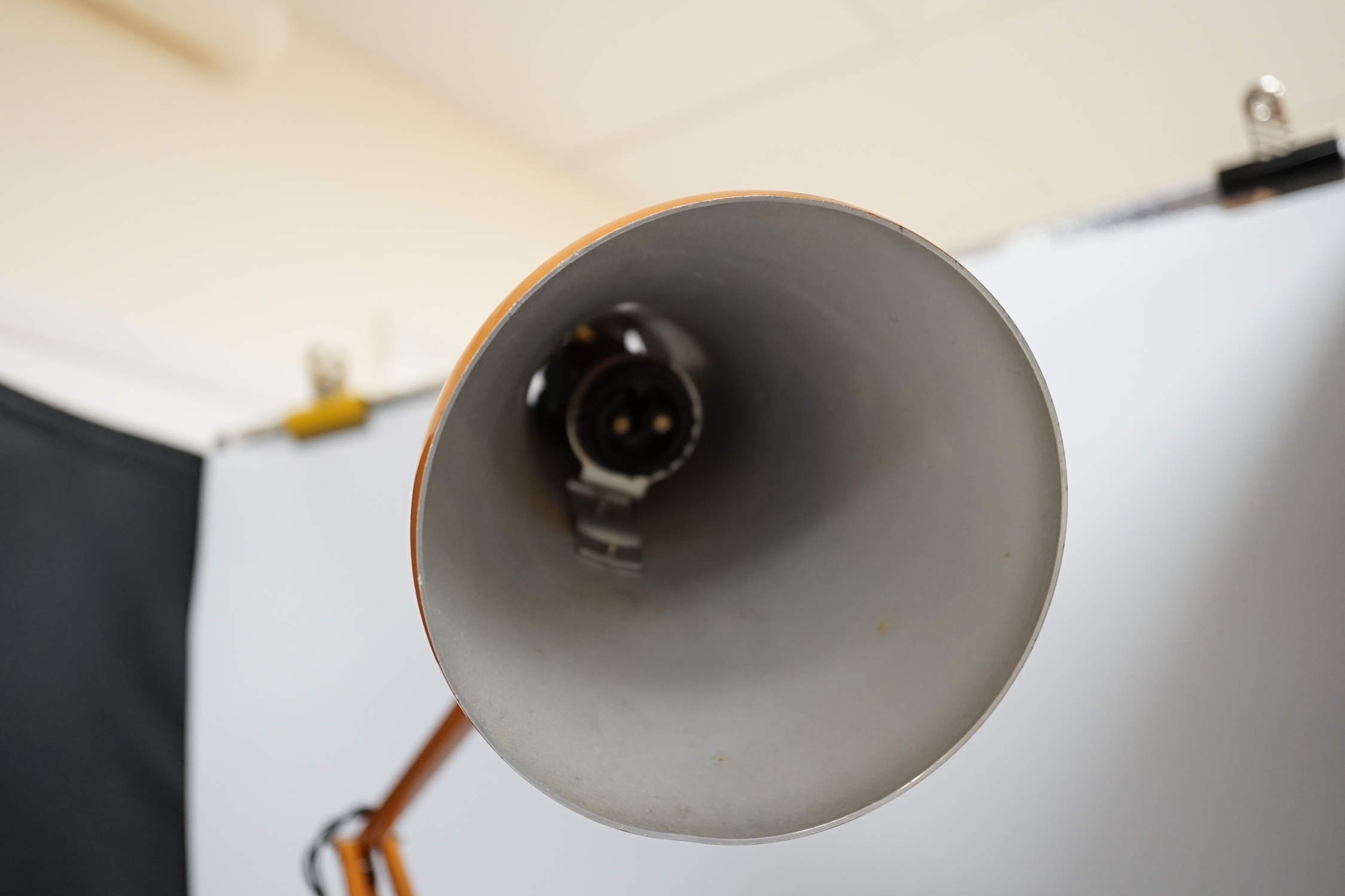 A Herbert Terry orange anglepoise lamp, highest height 89cm